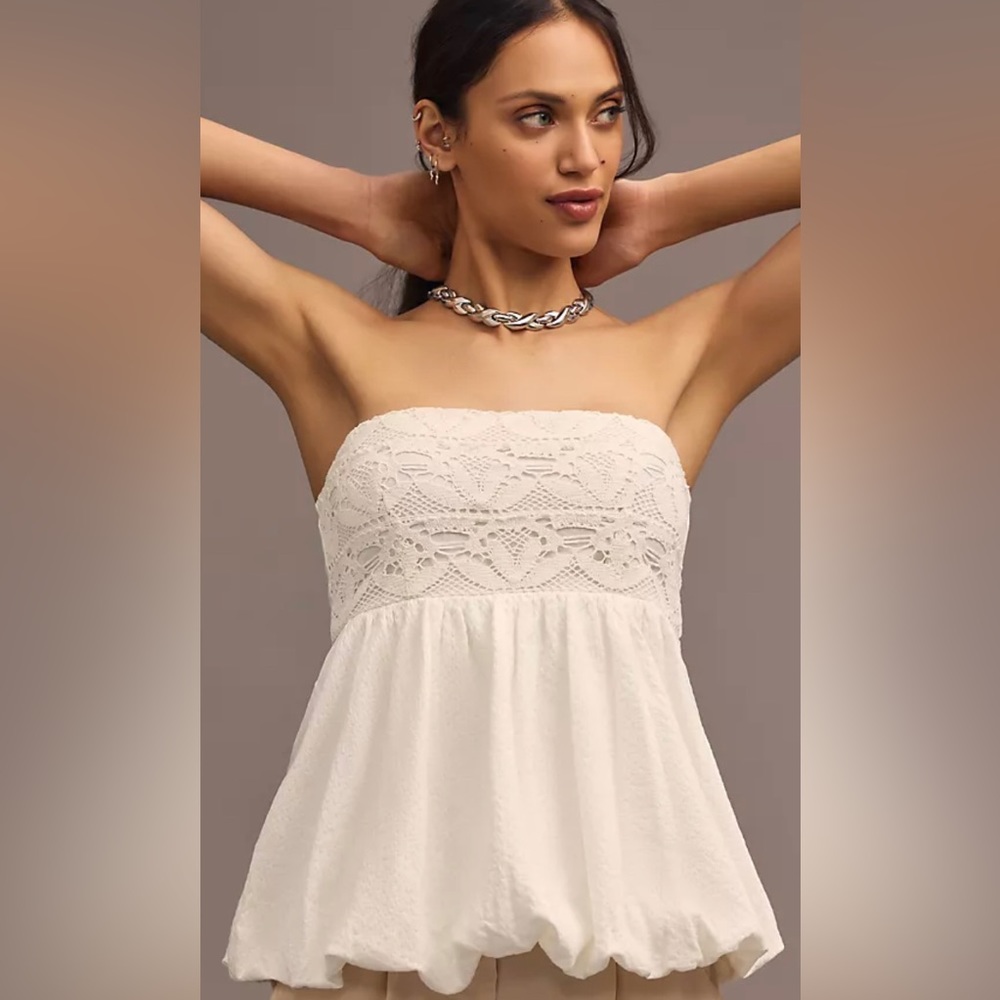 By Anthropologie strapless Bubble- Hem Top. Never worn, new with tags
